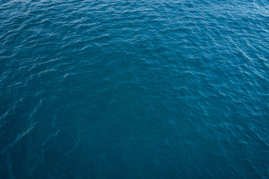 Beach Top View With Pattern Wave. Stock Photo Image Of Blue Color Deep Ocean Water, Sea Surface. Soft Blue Ocean Wave, Turquoise Waves, Clear Water Surface. Nature Surface Background Texture Design