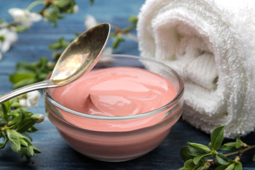 Cosmetic clay. Pink cosmetic clay in different types on a blue wooden table. face mask and body....
