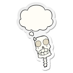 cartoon spooky skull and thought bubble as a printed sticker