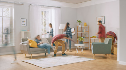 Time-Lapse Silhouettes or Blurred Happy Young Couple Moves into New Apartment, Arranges Furniture,...