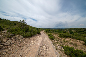 Rural road between mountains of the Sierra de Gudar, Valbona