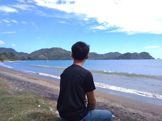 young man on the beach