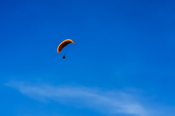 Paramotor flying on the sky