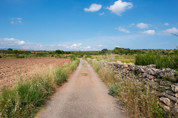 Rural road between mountains of the Sierra de Gudar, Valbona