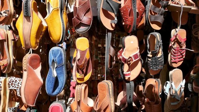 Colorful leather sandals in a Moroccan souk store