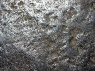 Metal wall for background. Scratches, sun glare, sand drifts.