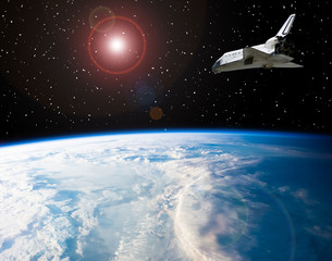 Naklejka premium Shuttle that flies in space. The elements of this image furnished by NASA.