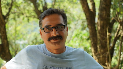 portrait of young man in park
