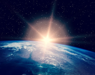 Sunrise over the earth. The elements of this image furnished by NASA.