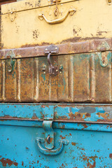                         Stack of Metal rusty suitcases - vintage decoration for interior or garden. Background texture