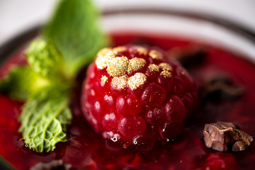Dark Chocolate Mousse Pudding with Raspberries.