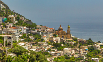 Fototapeta premium Positano Hill View. Beautiful view of Positano at daytime, with its colorful buildings along the hill. Amalfi coast situated in province of Salerno, in the region of Campania, Italy.