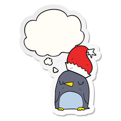 cute christmas penguin and thought bubble as a printed sticker