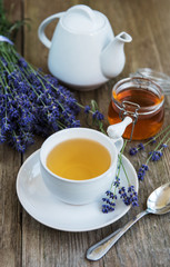 Cup of tea and honey with lavender flowers