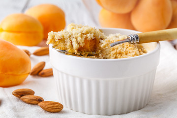 Seasonal fruit crumble dessert with cream ready to serve