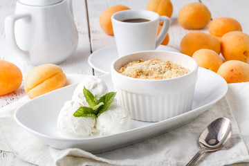 Dessert with apricot and ice cream. Selective focus