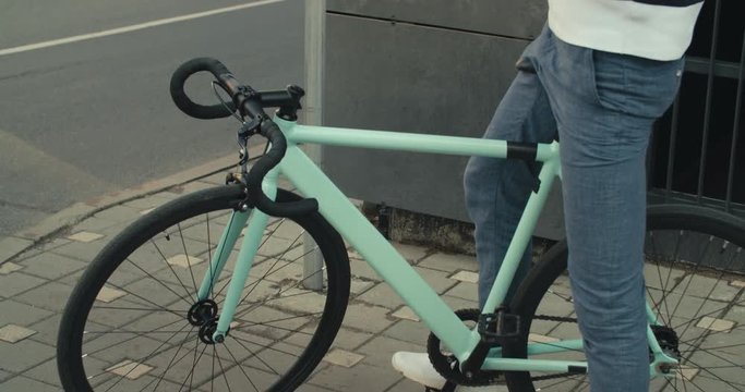 Cyclist man and fixed gear sport bike