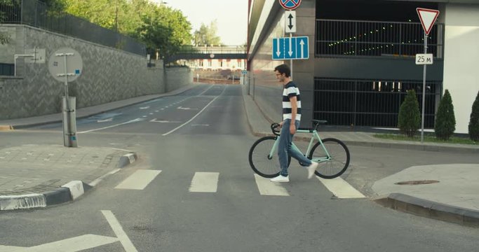 Cyclist man riding fixed gear sport bike