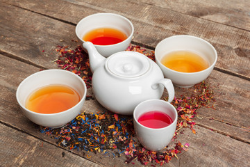 Creative layout made of cup of herbal tea on a wooden background