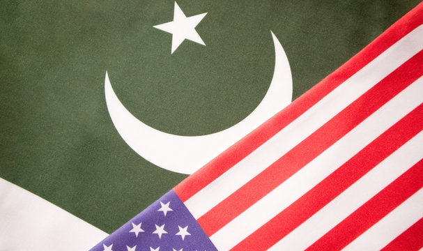 Concept of Bilateral relationship between two countries showing with two flags: United States of America and Pakistan.