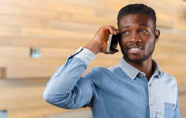 Young black business man using his cellphone