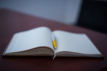 open book on wooden table