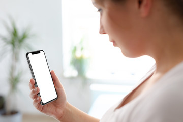 Woman using smartphone blank screen in hand