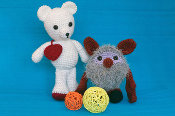 Amigurumi dolls Polar bear and brownie heart and balls of wool.