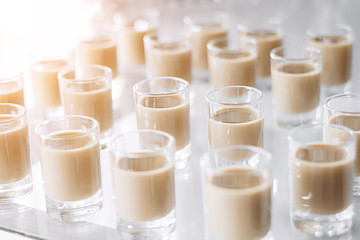 Festive table with cold exotic alcoholic beverages, cocktails. Party and holiday celebration concept