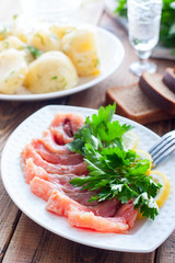 Homemade red salted fish on a white bowl, selective focus