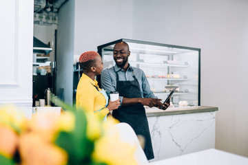 Black waiters using tablet during break