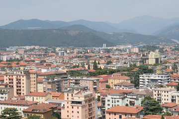 Fototapeta na wymiar Brescia City skyline with mountains view from top