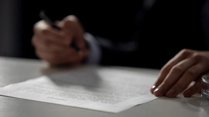 Female hand signing contract closeup, property purchase, business sale closeup