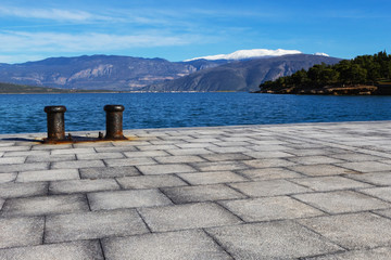 Bollard on the dock of Greek fishing village.