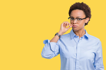 Young beautiful african american business woman over isolated background mouth and lips shut as zip...