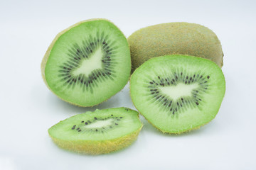 Fototapeta na wymiar Ripe whole kiwi fruit and half kiwi fruit isolated on white background