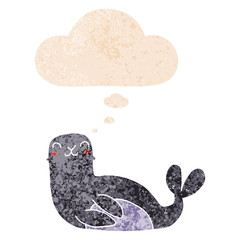 cartoon seal and thought bubble in retro textured style