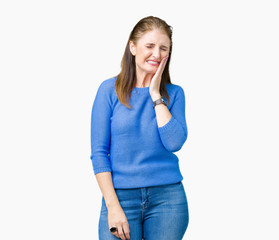 Beautiful middle age mature woman wearing winter sweater over isolated background touching mouth with hand with painful expression because of toothache or dental illness on teeth. Dentist concept.