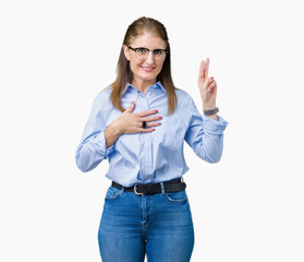 Beautiful middle age mature business woman wearing glasses over isolated background Swearing with...