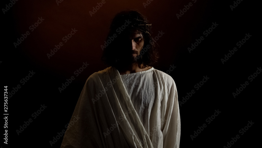 Poster god jesus in crown of thorns standing in dark, punishment for mortal people sins - Posters