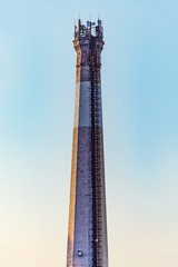 Chimney by the plant with electronic equipment.