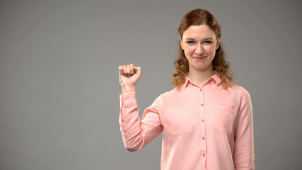 Asl teacher saying yes in sign language grey background, communication gesture