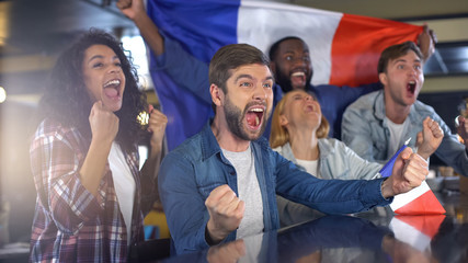 Emotional french spots supporters with flag happy about victory in championship