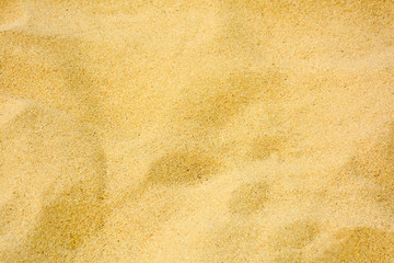 closeup of sand pattern of a beach in the summer