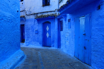 Blue street walls of the popular city of Morocco, Chefchaouen. Traditional moroccan architectural details. - 275642139