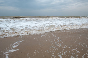 Sea during a storm. Waves against the sky. There is a place for text. Copy space. Summer concept