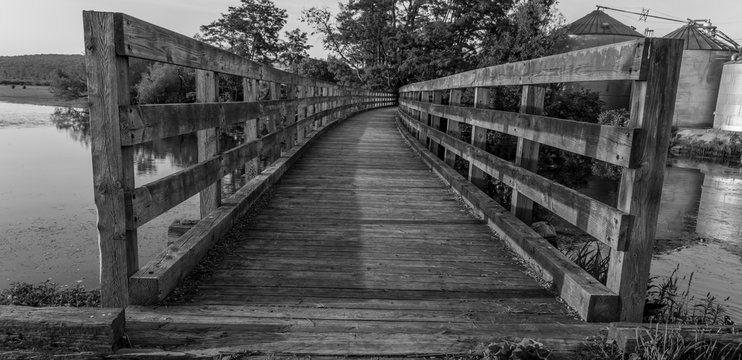 old wooden bridge trestle over the water 
