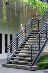 Stairway with black metallic banister modern building architecture