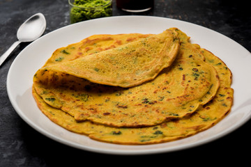 Chilla or Besan cheela is a simple pancake made with chickpea flour and some basic ingredients served with green chutney and tomato sauce, also known as veg-omelette