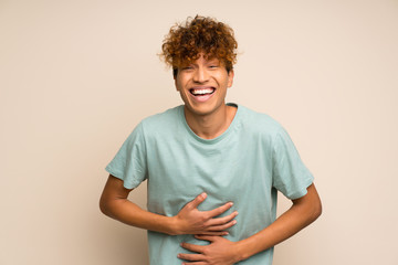 African american man with green shirt smiling a lot